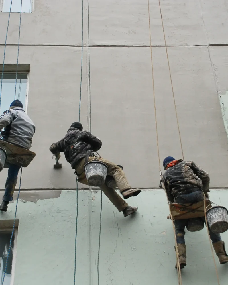 workers-hang-on-safety-ropes-and-restore-the-wall-2024-09-16-22-49-31-utc